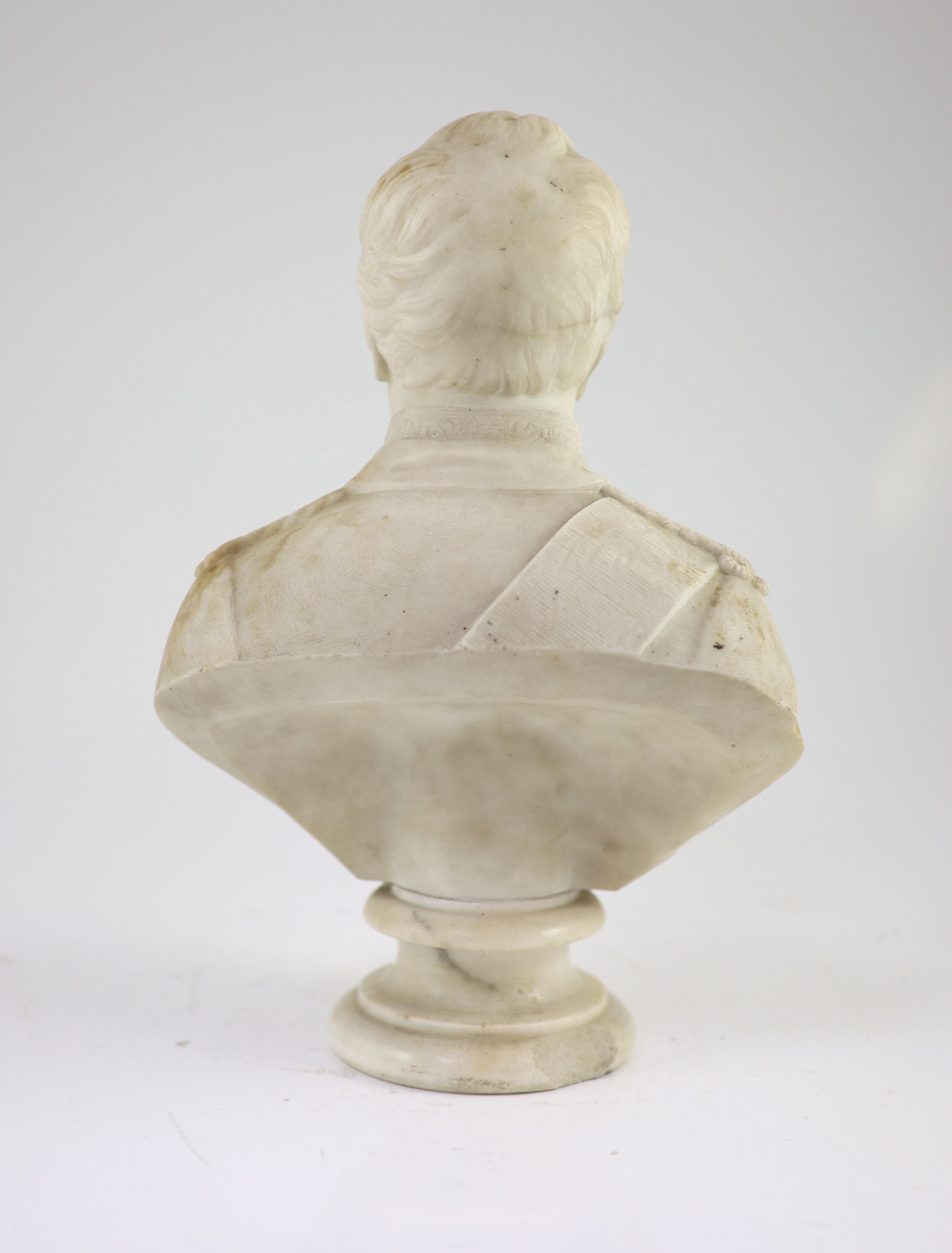 A mid 19th century marble bust of a British Peninsular War army officer wearing the Army Gold Cross and Garter Star, 34cm high